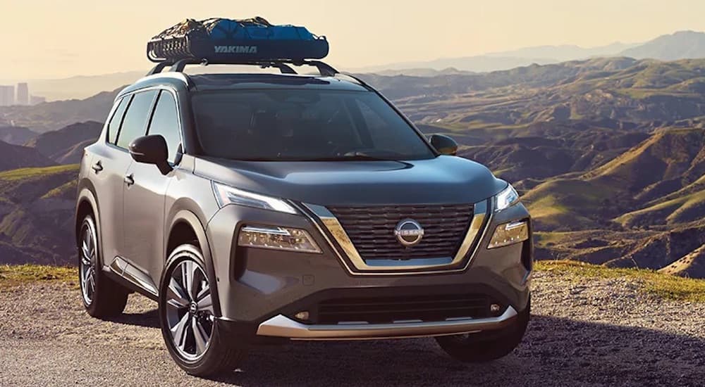 A grey 2024 Nissan Rogue is shown from the front at an angle.