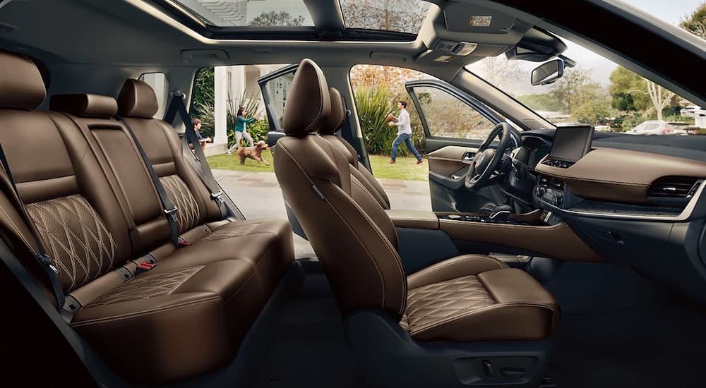 A side angle view of the brown interior seating of a 2024 Nissan Rogue.