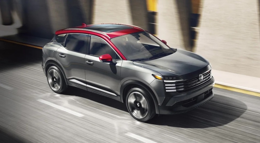 A grey 2025 Nissan Kicks SR is shown from the side after leaving a Nissan dealer near Morristown.