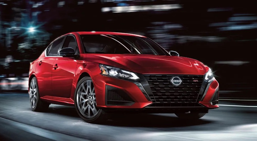 A red 2025 Nissan Altima for sale is shown from the front at an angle.