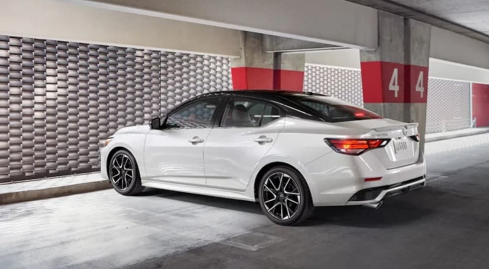 A white 2025 Nissan Sentra SR parked in a parking garage.