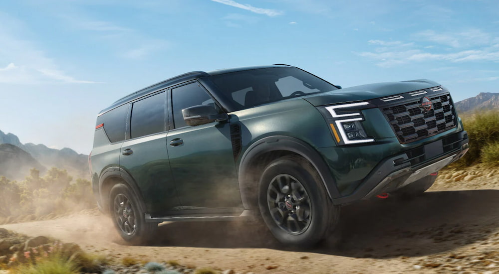 Grey 2025 Nissan Armada Pro 4X driving off-road.