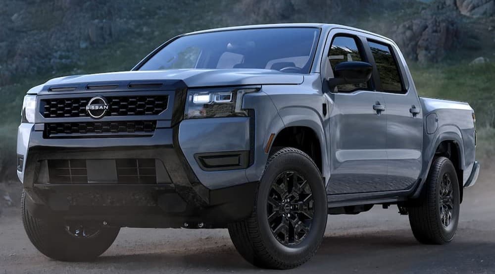 A gray 2026 Nissan Frontier parked off-road.