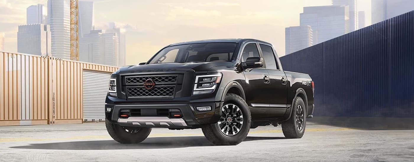 A black 2024 Nissan Titan Pro-4x is shown from the front at an angle after leaving a Nissan dealer near LaFollette.