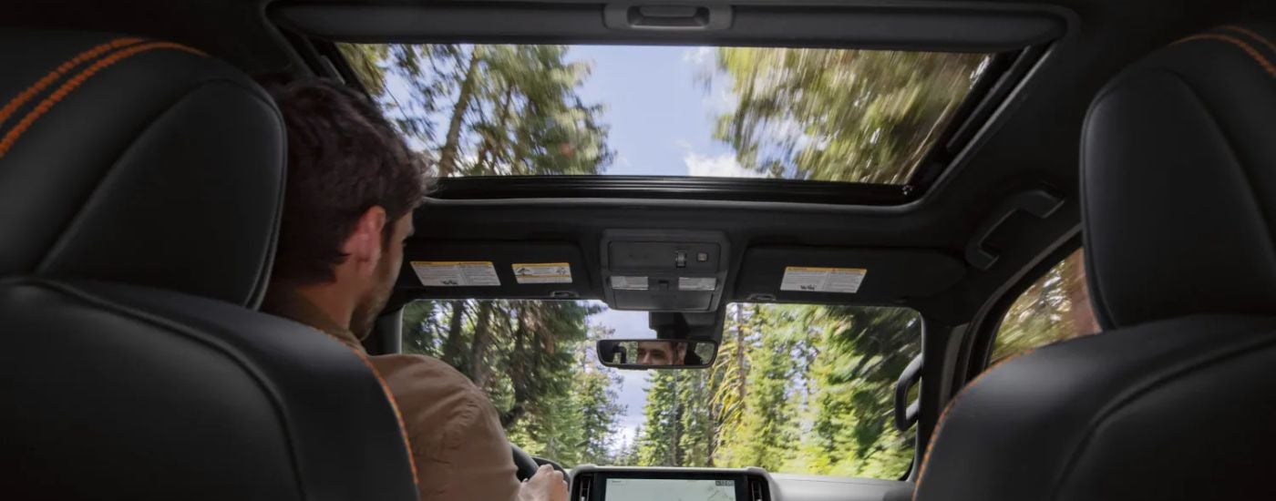 The interior and moonroof of a 2026 Nissan Frontier.