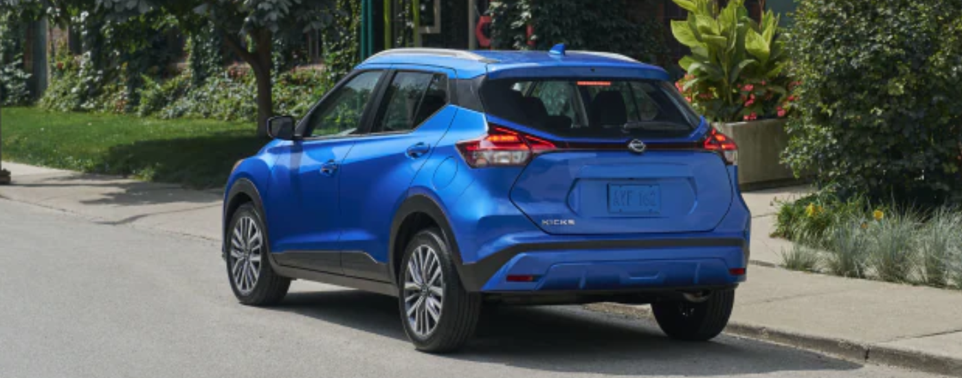 Blue 2025 Nissan Kicks Play parked on the street